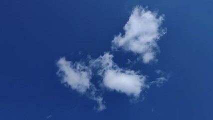 altocumulos clouds moving in the deep blue sky in the noon
