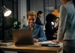 © Anna - Diverse team collaborating in modern office environment during evening.