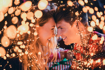 Photo of nice young couple smile touch forehead wear christmas clothes enjoy cozy x-mas party decoration interior flat indoors