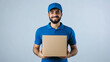 © Duygu - Smiling Delivery Man in Blue Uniform Holding Package on White Background