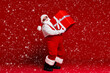 © deagreez - Full length body size view of his he attractive cheerful Santa father carrying big large giftbox fast delivery sale discount isolated bright vivid shine vibrant red color background