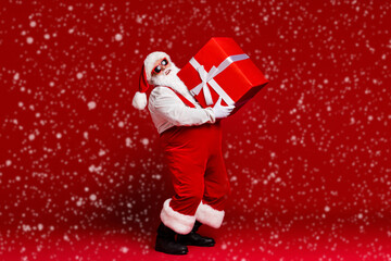Wall Mural - full length body size view of his he attractive cheerful santa father carrying big large giftbox fas