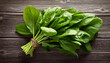 © Galeno - fresh bunch green spinach leaves sit old gray wooden table