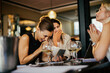© Marko Geber - Businesswomen celebrating success with drinks after work