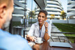 © Marko Geber - Female doctor enjoying coffee break outdoors with colleague