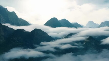 Aufkleber - Captivating sequence showcasing majestic mountain peaks, their dark silhouettes contrasting against a serene expanse of white clouds, creating a surreal and dreamlike atmosphere