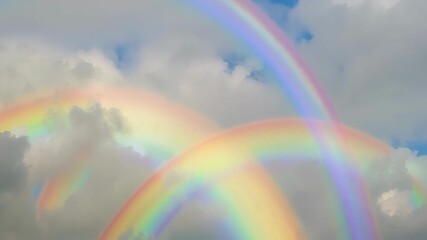 Aufkleber - Two rainbows are morphing in a cloudy sky. This surreal stock footage is perfect for projects that evoke hope, dreams, and fantasy