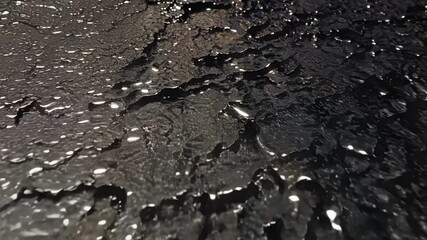 Aufkleber - Black liquid surface reflecting light, forming abstract shapes. Ideal for projects related to oil, pollution, nature, and surreal concepts