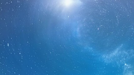 Aufkleber - Camera is being pulled through a wormhole in space. Blue and purple nebula clouds surround the camera as it gets closer to a bright light