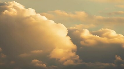 Aufkleber - Surreal cloudscape features golden, puffy clouds transforming as they drift across the sky. The scene captures a serene atmosphere filled with warm hues and dreamlike beauty