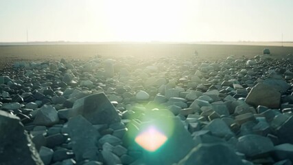 Aufkleber - Surreal landscapes showcase light traveling over a rocky field under a bright sun. Nature's beauty unfolds in a serene environment, creating a peaceful and calming atmosphere