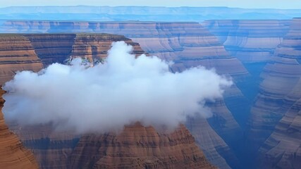 Poster - Lone cloud flows majestically over a vast canyon, casting a surreal and ever changing shadow on the rugged landscape below