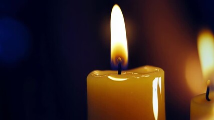 Poster - Candlelight flickers, casting a warm glow and creating a mesmerizing, surreal effect through repetition. The interplay of light and shadow evokes feelings of peace and tranquility