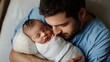 © kitipol - Very realistic photo of a father gazing lovingly at his newborn baby swaddled in a soft white blanket The father, dressed in a plain blue hospital gown, cradles the sleeping baby close, capturing a