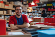 © mertingen - Smiling male grocery worker with vegetable crate