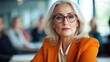 © Lens Legacy - An elegant older woman with silver hair and glasses conveys wisdom and calm confidence in a sophisticated setting, exemplifying experience and grace.