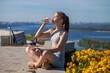 © Andrey_Arkusha - Young beautiful girl drinks water from a bottle after sports training