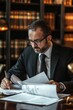 © Sasint - Portrait of a lawyer preparing legal documents in a professional setting