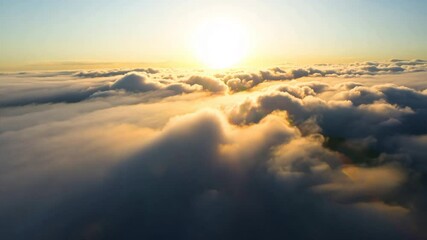 Wall Mural - golden sunbeams pierce through fluffy clouds, painting a breathtaking sunrise over misty mountain pe