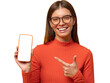 © Damir Khabirov - Portrait of happy young woman pointing to blank phone screen