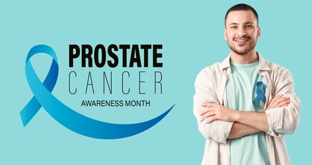 Young man with blue ribbon on color background. Prostate Cancer Awareness Month