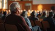 © Suplim - Elderly Man Attending Event in Auditorium