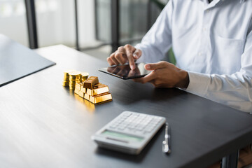 Gold Trading business man hand offering gold Investment in gold mining company or Trading gold on the stock exchange Rising gold prices.