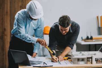 Team Engineers with draft plan of building on constructing site. Engineer work on site. engineer visit and inspection site engineer. Inspector engineer check and working on site.