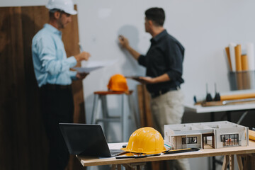 Team Engineers with draft plan of building on constructing site. Engineer work on site. engineer visit and inspection site engineer. Inspector engineer check and working on site.