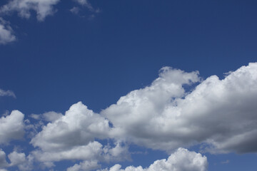 Wall Mural - it's a blue sky with puffy clouds