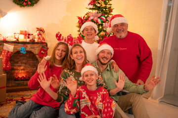 Group of happy family smiling happy celebrating christmas toasting with wine. Family member enjoy home made turkry grill dining togather at home. Christmas and New Year interior concept.