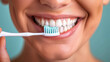 © AlexPhototest - young adult with braces is smiling while brushing their teeth carefully, showcasing bright and healthy smile. This emphasizes dental hygiene and self care