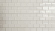 © Ice Cream Paradise - pattern of perfectly square, white tiles with white grout arranged in rows and columns, creating a flawless grid
