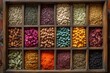 © Lubos Chlubny - Colorful spices and herbs filling sections of wooden typesetter drawer