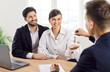 © Studio Romantic - Real estate agent gives house keys to smiling married couple, close-up. The happy couple rented an apartment from a real estate agency. Concept of buying real estate, investment, mortgage