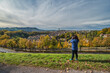 © Noppasinw - Bern (Berne) Switzerland woman tourist taking photo at old town and Aare River in autumn season