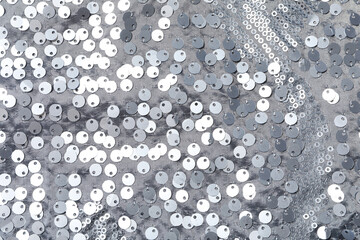 Wall Mural - Gray shiny background with sequin fabric texture, top view