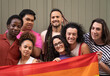 © PapatoniC - LGBT gay multiethnic people posing together smiling at camera isolated on green background