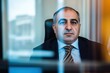 © Jaemie - Professional portrait of an Iraqi man in a suit, featuring a blurred background and warm tones; ideal for business and cultural themes.