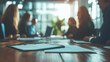 © Warisa - office meeting blurred background with business people working group in boardroom discussion