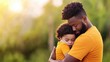 © Nitchalee N. - A tender moment of a father embracing his child, highlighting the love and connection in a serene outdoor setting.