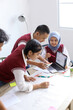 © Gatot - High School Students Doing School Work Together at The Study Room