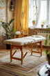 © ADDICTIVE STOCK CORE - Cozy massage room interior with natural light. Generative AI image