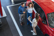 © Dragana Gordic - Happy Couple Buying New Car at Dealership with Salesperson