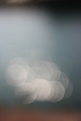 Wall Mural - an abstract view of the bright sunlight shimmering in the surface of the water.