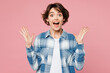 © ViDi Studio - Young shocked surprised amazed excited woman wearing blue shirt white t-shirt casual clothes spread hands look camera isolated on plain pastel light pink background studio portrait. Lifestyle concept.
