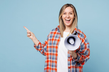 Wall Mural - Young woman wear red shirt t-shirt casual clothes hold in hand megaphone scream announces discount sale Hurry up isolated on plain pastel light blue cyan background studio portrait. Lifestyle concept