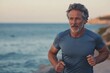 © Vlad - Active Middle Age Man Enjoying Beach Run, Athletic Caucasian Adult Running by the Sea