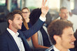 © Penn/peopleimages.com - Man, business people and raising hand with proposal in seminar for presentation, pitch or question. Team, group and collaboration for employee engagement, discussion or conference in corporate office
