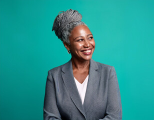 Studio Portrait of Beautiful Mature Older Woman Smiling Against Colored Background	